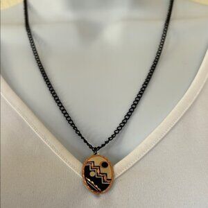 Upcycled vintage Southwest copper and black tone earring pendant on black chain